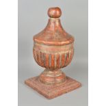 A 19TH CENTURY PAINTED GESSO FINIAL, the carved wooden urn shaped finial on a circular foot