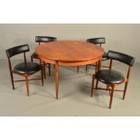 VICTOR B WILKINS, A G PLAN FRESCO CIRCULAR TEAK EXTENDING DINING TABLE, on cylindrical tapering legs