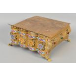 A 20TH CENTURY GILT METAL FOOTSTOOL, of rectangular form, the hinged top with engraved decoration