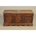 A LATE 17TH CENTURY OAK COFFER, the hinged top with two panels the front with three panels, all