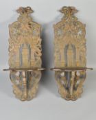 A PAIR OF EARLY 20TH CENTURY CARVED WOOD WALL BRACKETS, stained and painted finish, carved with