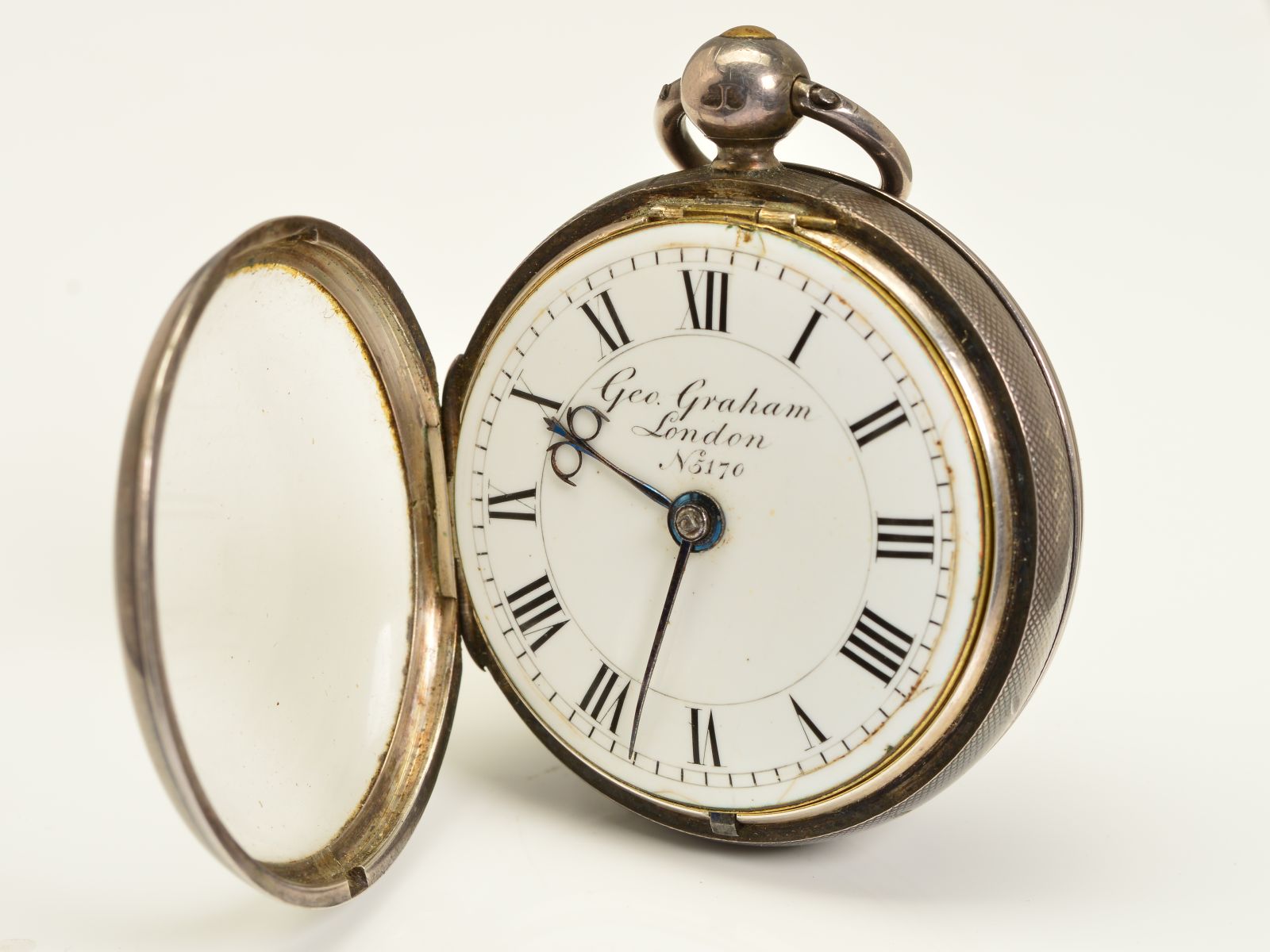 A SILVER OPEN FACED POCKET WATCH, the enamel dial named Geo. Graham ...