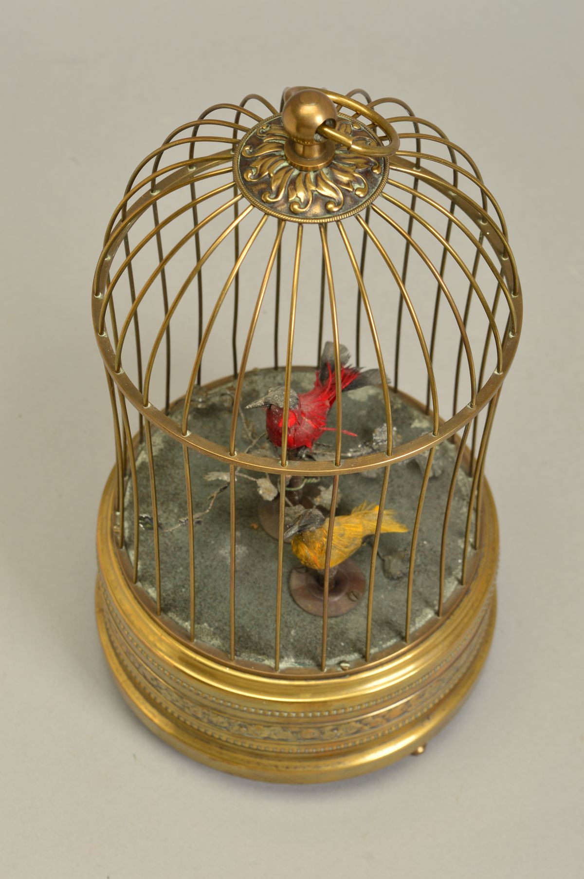AN EARLY 20TH CENTURY CLOCKWORK AUTOMATON OF TWO BIRDS IN A BRASS CAGE, both birds sing and move - Image 4 of 6