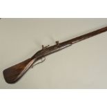 AN ANTIQUE MATCHLOCK MUSKET, fitted with a 199cm (46.8'') barrel, its lock and pan cover are in