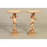 A PAIR OF MID 20TH CENTURY PAINTED WOODEN SIDE TABLES, the wavy circular faux marble top on a