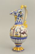 A SPANISH FAIENCE EWER, the grotesque beast handle adjoining a bird style spout with 'NO8DO' painted