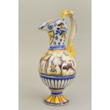 A SPANISH FAIENCE EWER, the grotesque beast handle adjoining a bird style spout with 'NO8DO' painted