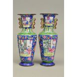 A PAIR OF 19TH CENTURY CHINESE ENAMEL TWIN HANDLED VASES, of baluster form, blue ground decorated