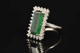 A LATE 20TH CENTURY 18CT GOLD RECTANGULAR SHAPED GREEN TOURMALINE AND DIAMOND CLUSTER RING, an