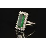 A LATE 20TH CENTURY 18CT GOLD RECTANGULAR SHAPED GREEN TOURMALINE AND DIAMOND CLUSTER RING, an