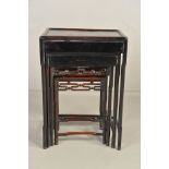 AN EARLY 20TH CENTURY QUARTETTO NEST OF FOUR CHINESE TABLES, with geometric carved aprons to all