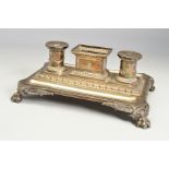 A VICTORIAN SILVER INKSTAND, of shaped rectangular form, fitted with a central deep rectangular open