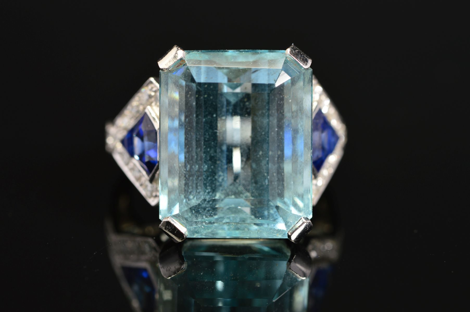 A MODERN AQUAMARINE, SAPPHIRE AND DIAMOND DRESS RING, centring on a principal trap cut aquamarine - Image 2 of 5