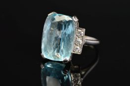 AN ART DECO AQUAMARINE AND DIAMOND RING, centring on a rectangular cut aquamarine measuring
