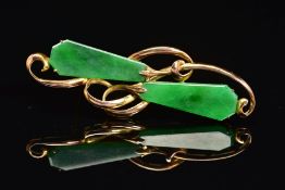 A JADE BROOCH, of horizontal organic design, set with two kite shape jade panels as abstract