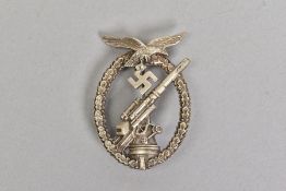 A GERMAN 3RD REICH LUFTWAFFE FLAK COMBAT BADGE, in silver, crisp and precise detail to the Eagle,