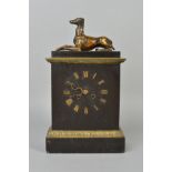 A LATE 19TH CENTURY BLACK SLATE AND GILT METAL MANTEL CLOCK, the rectangular top surmounted by a