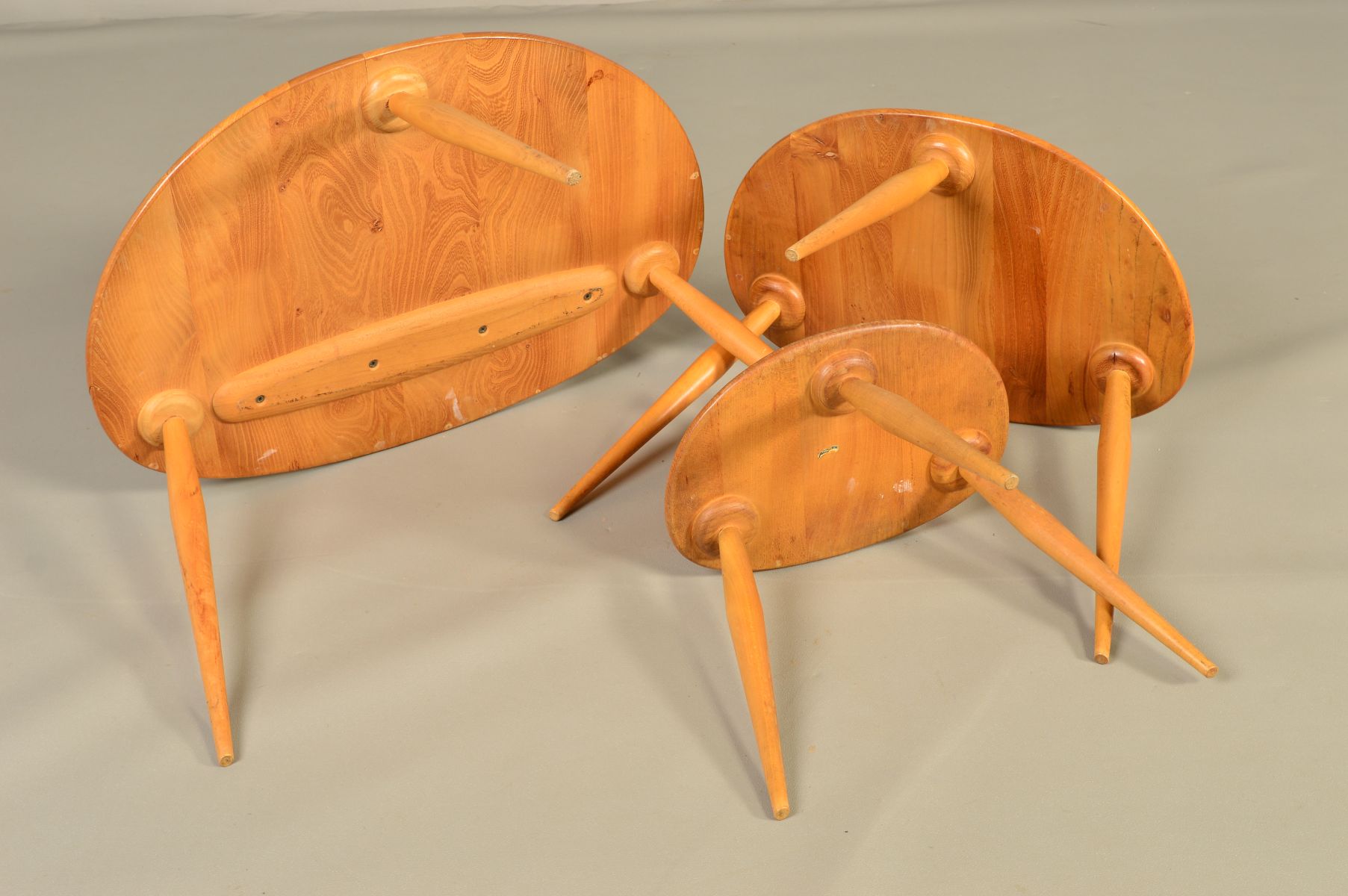 AN ERCOL BLONDE ELM PEBBLE NEST OF THREE TABLES, on triple beech cylindrical tapering legs, - Image 5 of 6