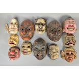 A COLLECTION OF TWELVE JAPANESE NOH MASKS, three with moveable bottom jaws, all wooden with a