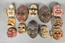 A COLLECTION OF TWELVE JAPANESE NOH MASKS, three with moveable bottom jaws, all wooden with a