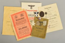 A NUMBER OF GERMAN WWII 3RD REICH MILITARY BADGES AND PAPERWORK, comprising of soldiers 'Soldbuch' 2