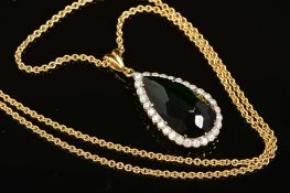 A MODERN 18CT GOLD PEAR SHAPE TOURMALINE AND DIAMOND CLUSTER PENDANT, a dark green tourmaline