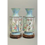 A PAIR OF 20TH CENTURY CHINESE ENAMEL VASES, conical neck over hexagonal body on a circular foot,