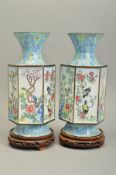 A PAIR OF 20TH CENTURY CHINESE ENAMEL VASES, conical neck over hexagonal body on a circular foot,