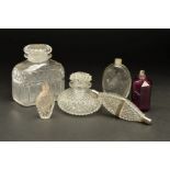 A LATE GEORGIAN DOUBLE ENDED CLEAR GLASS SCENT FLASK, diamond cut body, white metal mounts with