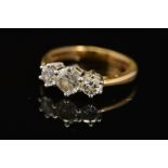 A MODERN 18CT GOLD THREE STONE DIAMOND RING, estimated total modern round brilliant cut weight 1.