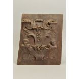 AN 18TH CENTURY CARVED RECTANGULAR WALNUT PANEL, the relief decoration of cartouche shape with