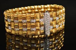 A MODERN 18CT GOLD ROBERTO COIN DIAMOND BRACELET, a wide flat panel link textured pattern with