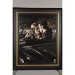 ROB HEFFERAN (BRITISH 1968), 'The City By Night', a study of two lovers in a classic car, oil on