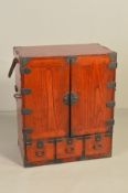A 20TH CENTURY KOREAN ELM AND METAL MOUNTED CABINET, the double doors enclosing eighteen drawers,