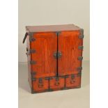 A 20TH CENTURY KOREAN ELM AND METAL MOUNTED CABINET, the double doors enclosing eighteen drawers,