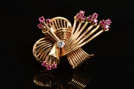 A LATE 20TH CENTURY 18CT GOLD, RUBY AND DIAMOND FAN DESIGN BROOCH, estimated modern round