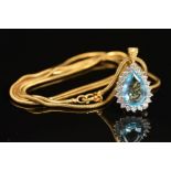 A MODERN PEAR SHAPE AQUAMARINE AND DIAMOND CLUSTER PENDANT AND CHAIN, a pear shape aquamarine