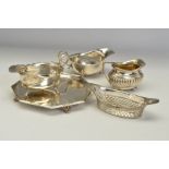 A PAIR OF GEORGE V SILVER OVAL SAUCE BOATS, wavy rims, 'S' scroll handles, on cabriole legs with