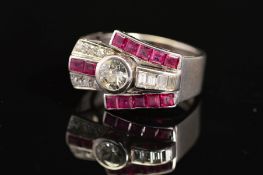 AN EARLY TO MID 20TH CENTURY RUBY AND DIAMOND COCKTAIL RING, centring on an early brilliant cut