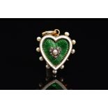 A LATE VICTORIAN ENAMEL, PEARL AND DIAMOND MEMORIAL HEART PENDANT, designed as a central seed