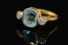 A MID TO LATE 20TH CENTURY AQUAMARINE AND DIAMOND THREE STONE RING, centring on a cushion mixed