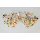 A PAIR OF EARLY 20TH CENTURY PAINTED WROUGHT IRON GIRANDOLES, in the form of sprays of flowers