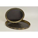 A PAIR OF GEORGE III HENRY CLAY PAPIER MACHE OVAL GRADUATED TRAYS, black with an inner gilt border