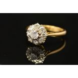 A MODERN ROUND BRILLIANT DIAMOND CLUSTER RING, estimated total diamond weight 0.99ct, ring size R