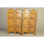 A 20TH CENTURY PAINTED PAPER LAID ON WOOD PERSIAN STYLE FOUR FOLD SCREEN, arched tops, foliate