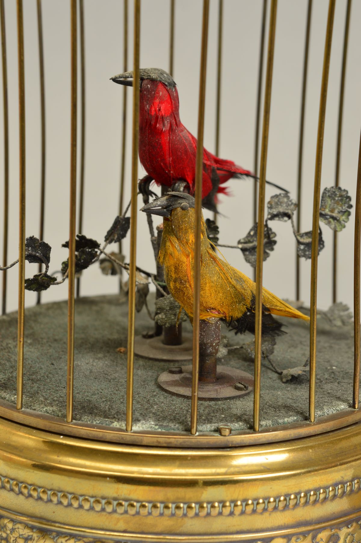 AN EARLY 20TH CENTURY CLOCKWORK AUTOMATON OF TWO BIRDS IN A BRASS CAGE, both birds sing and move - Image 5 of 6