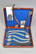 A WOODEN BOX CONTAINING SEVEN GERMAN 3RD REICH LANYARDS, to various units and formations,