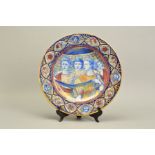 A LATE 19TH CENTURY CONTINENTAL HAND PAINTED MAIOLICA LUSTRE CHARGER, the circular rim decorated