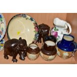 A SMALL GROUP OF ROYAL DOULTON AND THREE CARVED ELEPHANTS, to include three stoneware tavern and