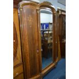 AN EARLY 20TH CENTURY WALNUT, AMBOYNA AND ROSEWOOD BANDED FRENCH EMPIRE STYLE TRIPLE DOOR WARDROBE/